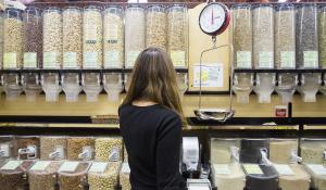 woman shopping in the bulk aisle