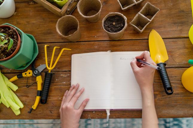 person writing about climate victory gardening