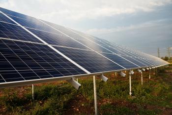 Image: solar panels in a field. Title: When Will Verizon Plug into Clean Energy?