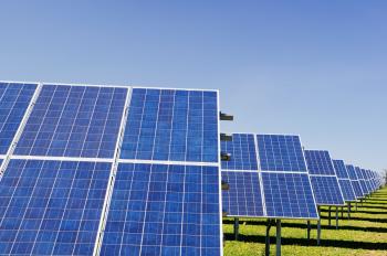 Image: solar panels in a field. Article: 5 Renewable Energy Myths Debunked