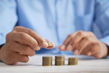 Image: person stacking gold coins. Title: New Green Bond Makes It Easy to Invest in Climate Action