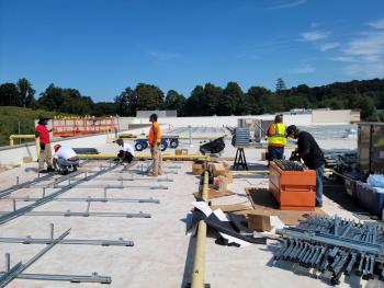 SUNS workers installing solar panels